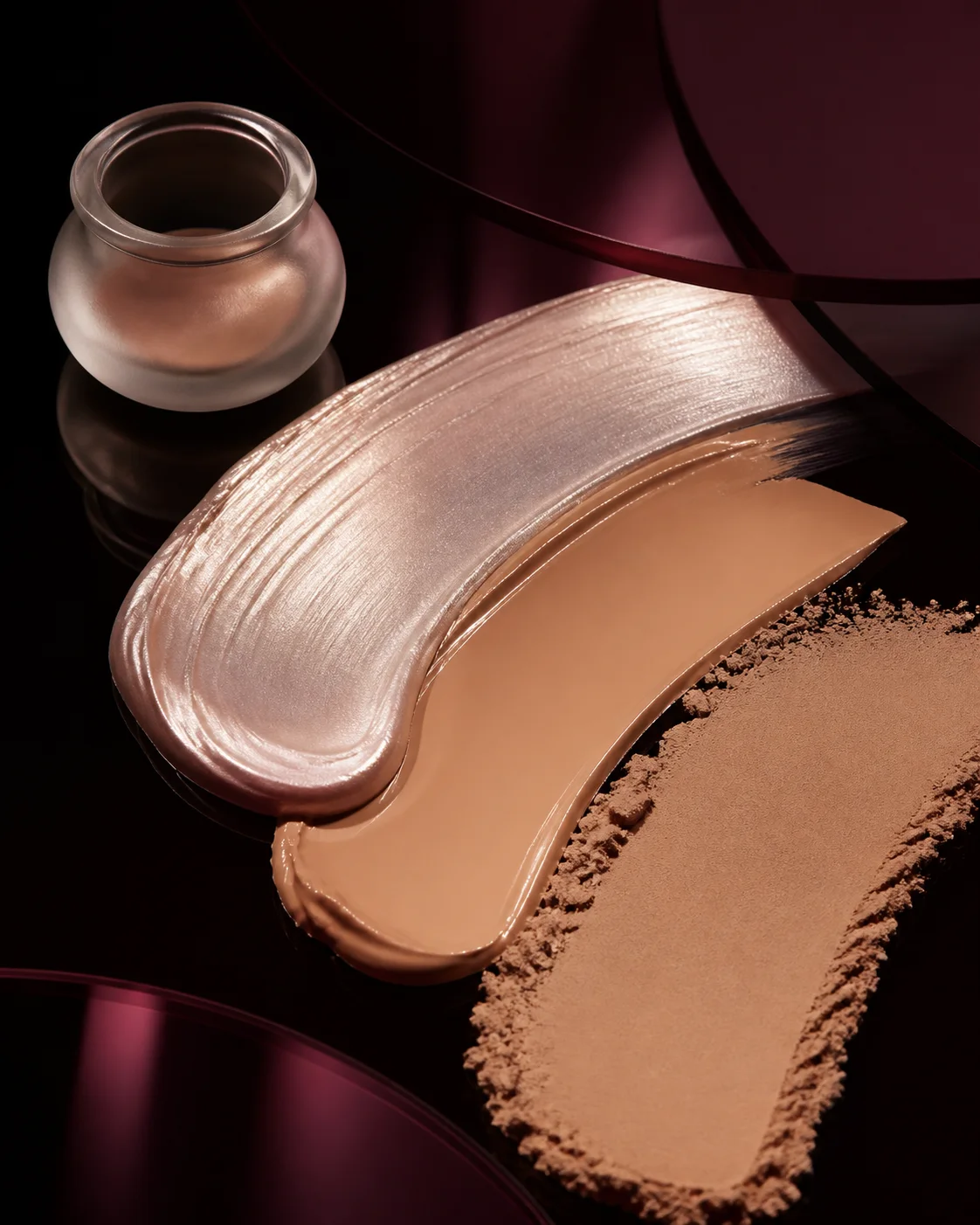 Complexion creams and powders arranged to compare texture and finish