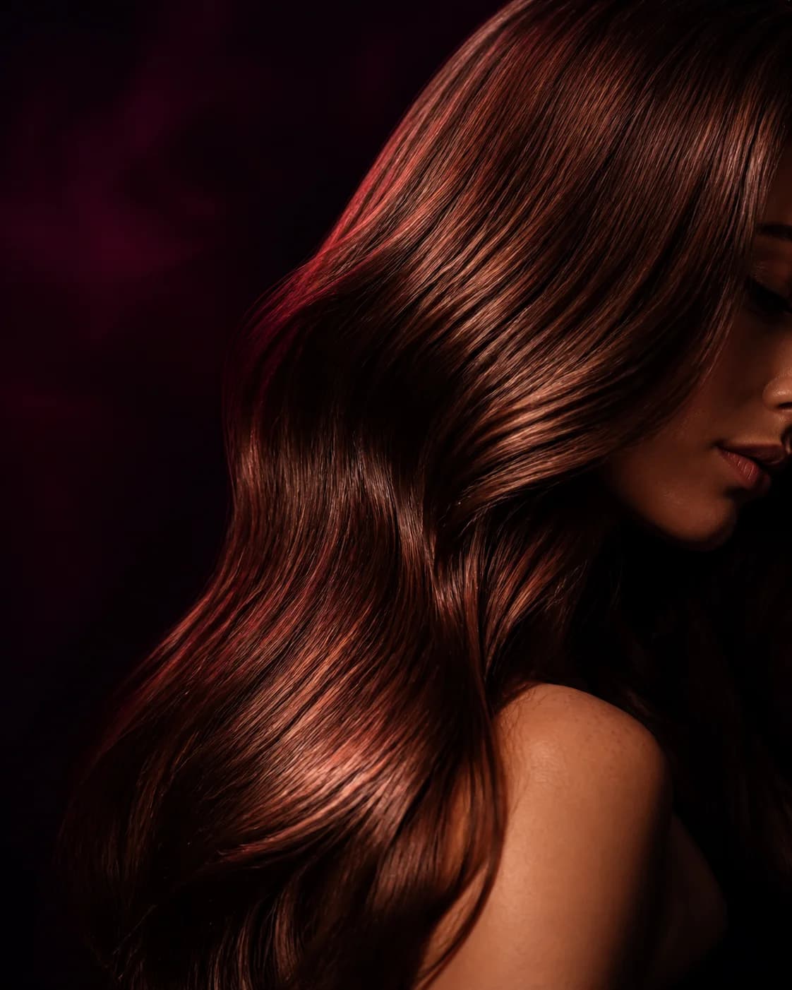 Sculptural copper-brunette hair in warm studio light